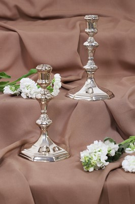 Lot 630 - A pair of Queen Anne silver candlesticks