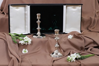 Lot 630 - A pair of Queen Anne silver candlesticks