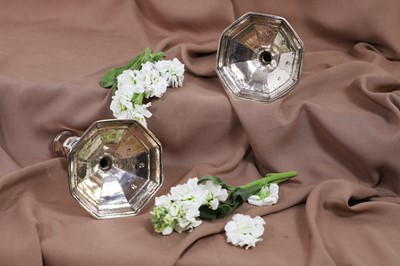 Lot 630 - A pair of Queen Anne silver candlesticks