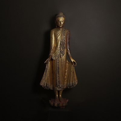 Lot 637 - A very large lacquered and giltwood figure of the standing Buddha