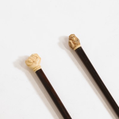Lot 232 - Two ivory and Macassar ebony walking sticks