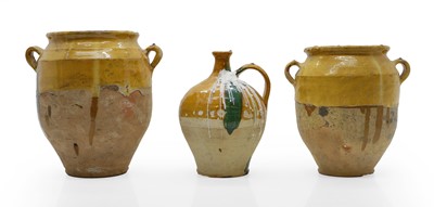 Lot 312 - Two partially glazed storage jars, and a bottle ewer