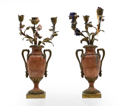 Lot 289 - A pair of pink marble and ormolu candelabra