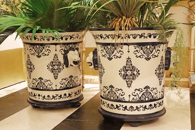 Lot 391 - A pair of Rouen-style iron orangerie urns