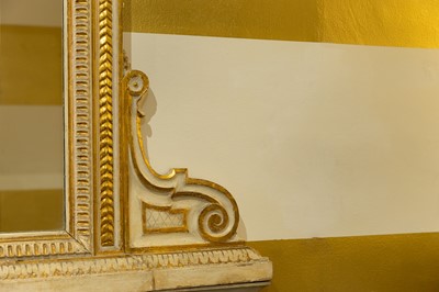 Lot 389 - A pair of neoclassical, painted and parcel-gilt, wooden pier tables
