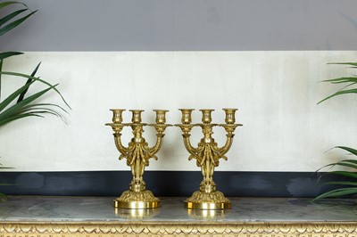 Lot 8 - A pair of Louis XVI ormolu candelabra in the manner of Delafosse of Paris