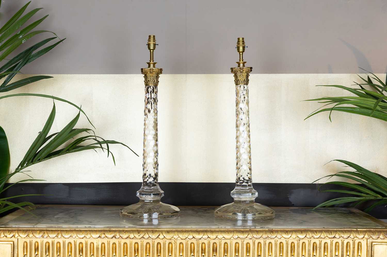 Lot 19 - A pair of clear glass column table lamps