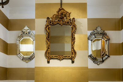 Lot 240 - A provincial Louis XV giltwood mirror