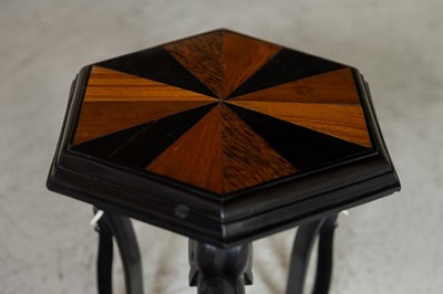 Lot 65 - An ebony and specimen wood table