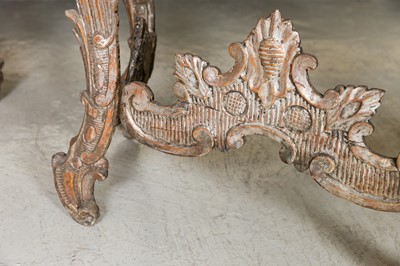 Lot 363 - A pair of rococo silvered console tables