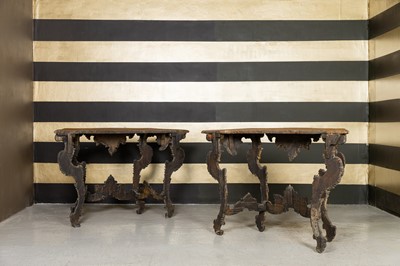 Lot 363 - A pair of rococo silvered console tables