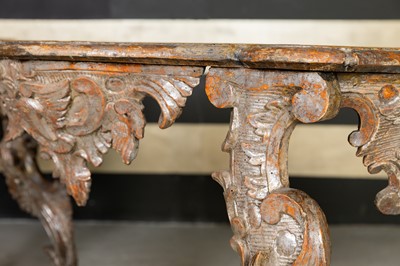 Lot 363 - A pair of rococo silvered console tables
