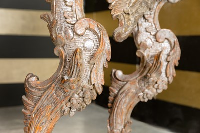Lot 363 - A pair of rococo silvered console tables