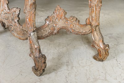 Lot 363 - A pair of rococo silvered console tables