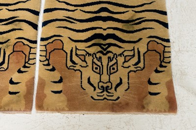 Lot 33 - A pair of wool 'tiger' rugs