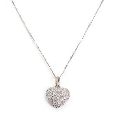 Lot 1115 - An 18ct white gold heart shaped diamond pendant and chain