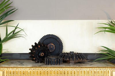 Lot 329 - A collection of four carved wood cogs