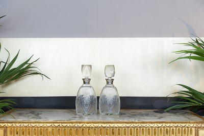 Lot 388 - A pair of engraved glass decanters