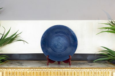Lot 399 - A blue-glazed porcelain charger