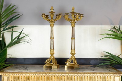 Lot 414 - A pair of Charles X six-branch candelabra