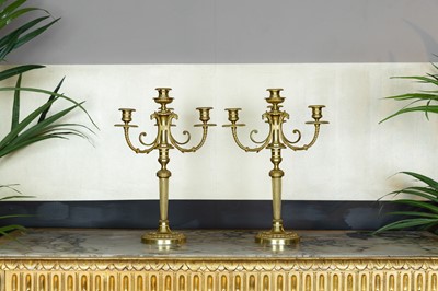 Lot 213 - A pair of Louis XVI-style ormolu candelabra