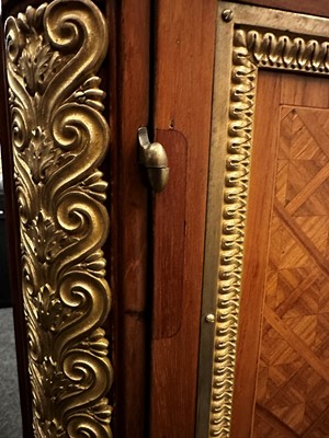 Lot 337 - A Napoleon III parquetry commode