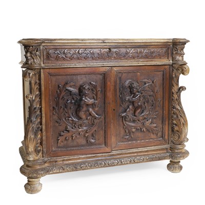 Lot 446 - A Continental walnut or fruitwood carved front cabinet