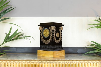 Lot 239 - A French Empire bronze cased mantel clock