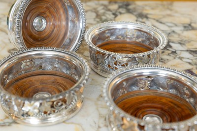 Lot 342 - A set of four Victorian silver-plated wine coasters