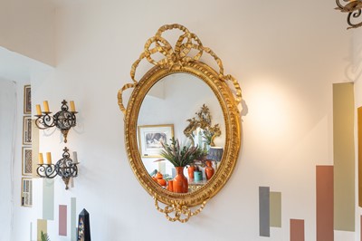 Lot 335 - A large giltwood and gilt-gesso oval wall mirror