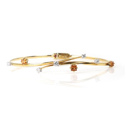 Lot 159 - An 18ct gold citrine and diamond bangle, by Roberto Coin