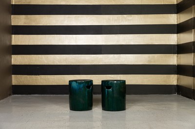 Lot 398 - A pair of green-glazed garden seats