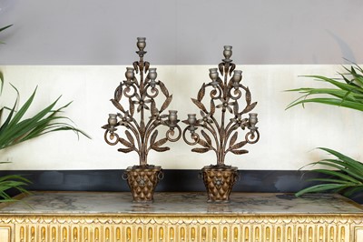 Lot 336 - A pair of gilt-iron five-light candelabra