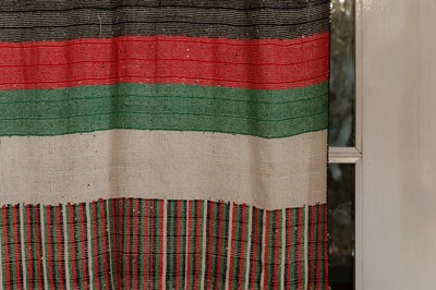 Lot 319 - A glass-beaded curtain