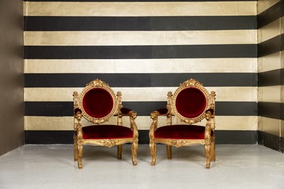 Lot 215 - A pair of Charles X giltwood armchairs