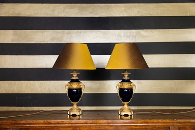 Lot 256 - A pair of Louis XVI-style porcelain and ormolu table lamps