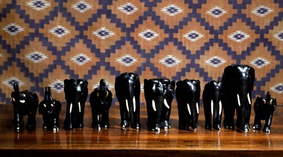 Lot 728 - A collection of ten carved wooden elephants