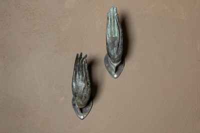 Lot 271 - A set of nine bronze hooks