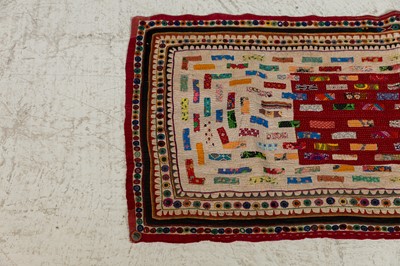 Lot 95 - An appliqué and mirrorwork baby's quilt