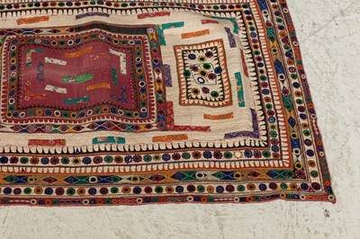 Lot 94 - An appliqué and mirrorwork baby's quilt