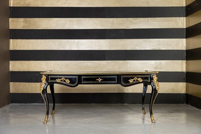Lot 214 - A Louis XV-style ebonised bureau plat