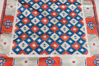 Lot 333 - A red-ground dhurrie runner