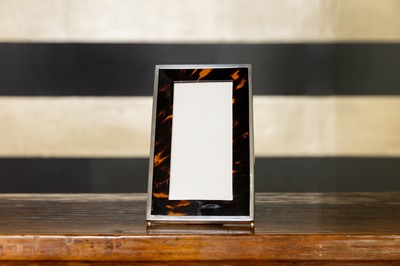 Lot 300 - A silver-mounted tortoiseshell photo frame
