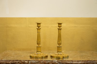 Lot 155 - A pair of ormolu candlesticks