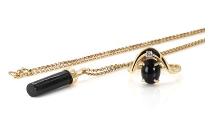 Lot 270 - A black coral pendant and a black coral and diamond ring
