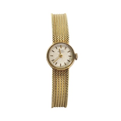 Lot 422 - An 18ct gold Girard Perregeux mechanical bracelet watch