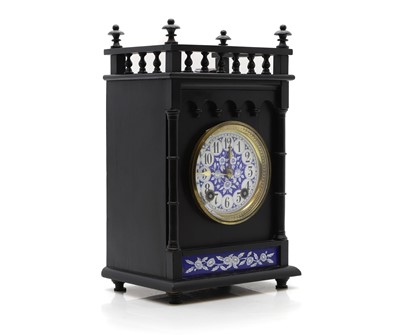 Lot 222 - An Aesthetic period oak cased mantel clock