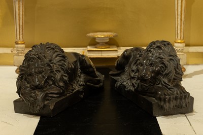 Lot 241 - A pair of black marble lions after Canova