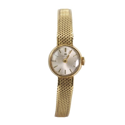 Lot 423 - A ladies' 18ct gold Tissot mechanical bracelet watch