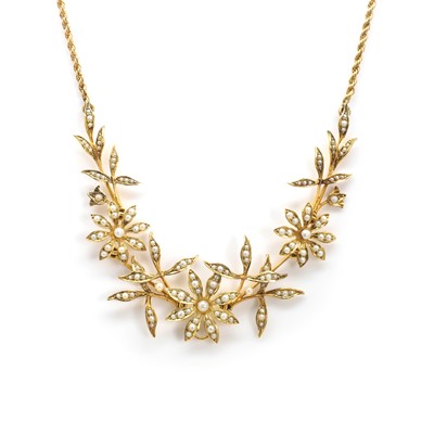 Lot 35 - An Edwardian gold split pearl floral and foliate necklace